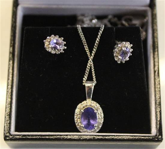 Tanzanite? and white gold pendant and chain and a matching pair of earrings